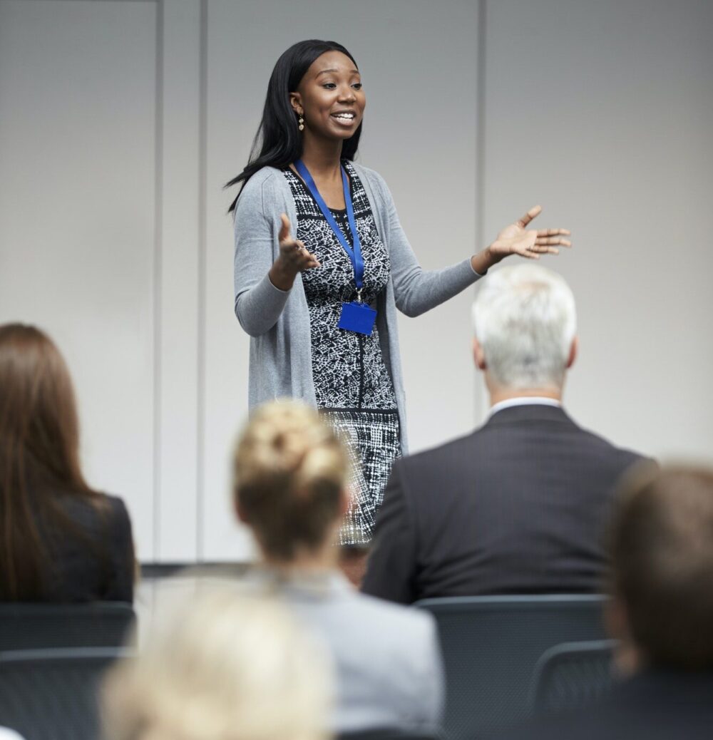 Businesswoman Making Presentation At Conference